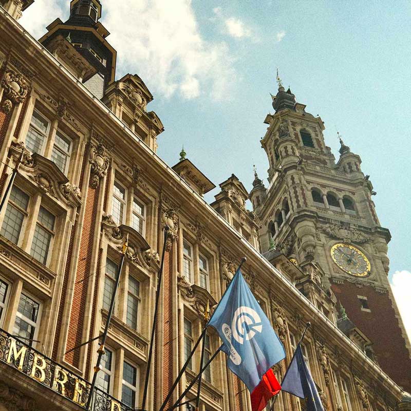 Traveler enjoying a guided walking tour of Lille, exploring local streets, markets, and historic landmarks with a local guide – authentic French city experience from London