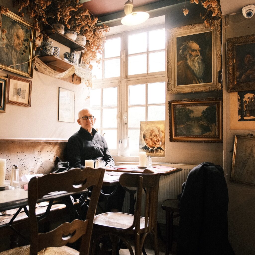 Student eating a traditional northern French dish in a local estaminet during a French immersion in Lille